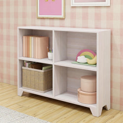 White wooden bookshelf with storage baskets, books, and decorative rainbow in a stylish pink room.