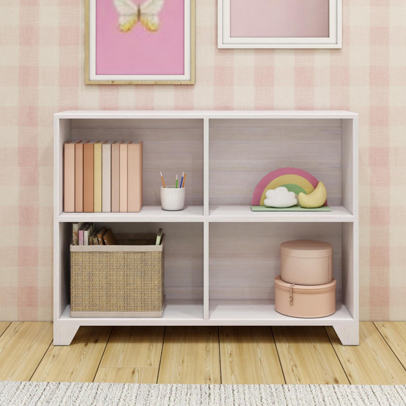 Modern children's bookshelf with decorative items and storage baskets in a pastel-themed room.