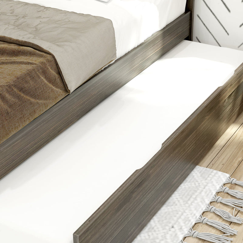 Modern storage bed with wooden frame and white trundle drawer in cozy bedroom setting.