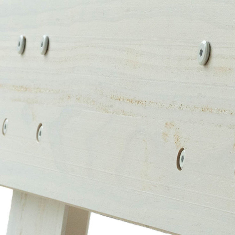 Close-up of light wooden plank with metal screws for furniture assembly.