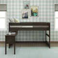 Kids loft bed with built-in desk in dark wood against green buffalo check wallpaper, styled with decorative pillows, framed mountain landscape art and mint rug — children's bedroom design