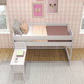 Children's pink plaid bedroom with white loft bed, pink and brown bedding, patterned pillows, framed butterfly wall art and a study bench with books