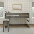 Wooden loft bed with built-in desk and pillows in a modern farmhouse kids' bedroom featuring neutral beige plaid wallpaper, framed pampas grass wall art and window light