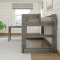 Gray rustic loft bed with built-in desk and ladder in a neutral farmhouse kids bedroom featuring beige plaid wallpaper, a window with Roman shade and potted plant