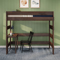 Dark walnut loft bed with built-in desk and black chair against green paneled wall, desk lamp and sports wall art, modern kids/teen bedroom workspace