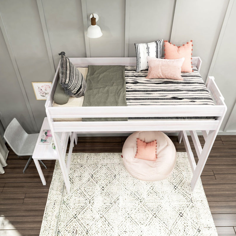 White wooden loft bed with striped bedding, blush pink throw pillows and under-bed desk over patterned rug in a modern boho kids bedroom