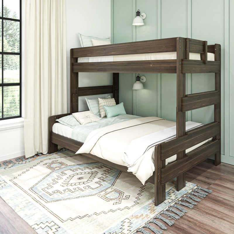 Dark wood bunk bed in a cozy kids' bedroom with mint green paneled wall, neutral bedding and pillows, patterned area rug and sunlit window