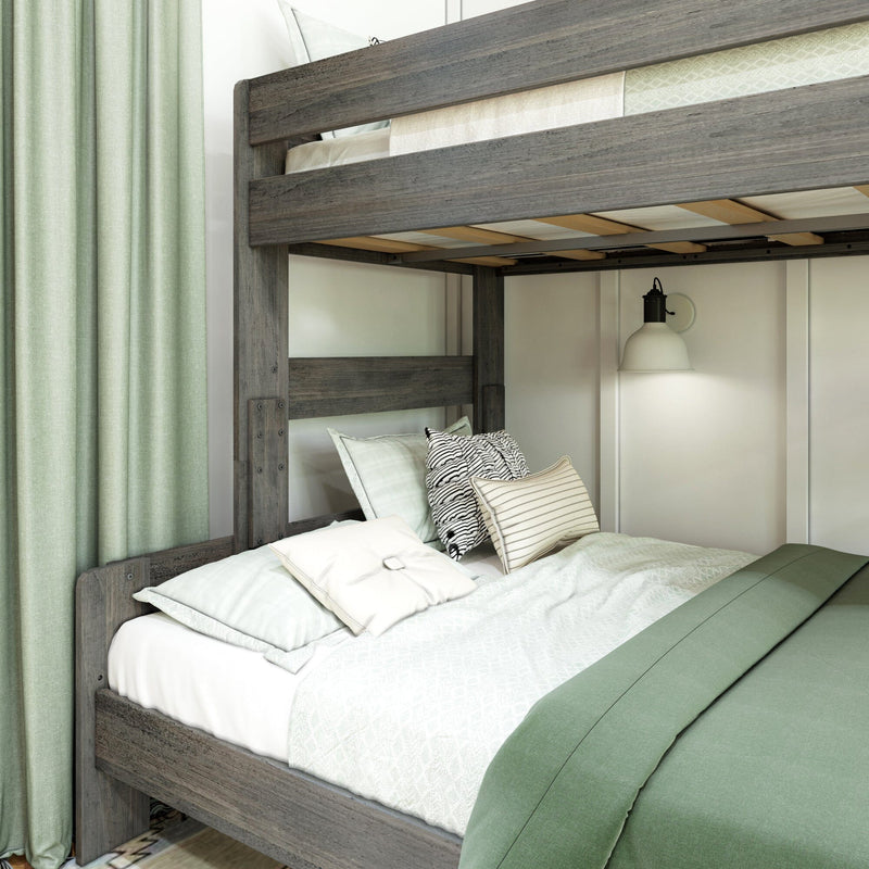 Gray reclaimed wood loft bunk bed with mint green bedding, striped and patterned pillows and wall sconce in a modern farmhouse bedroom