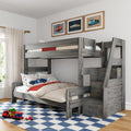 Gray wooden loft bunk bed with storage stairs in kids' bedroom, car-themed bedding, framed vintage car prints and blue checkered rug