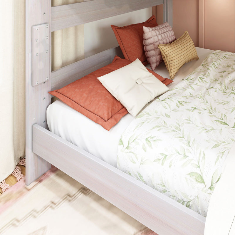 Whitewashed wooden bunk bed with rust-orange throw pillows, textured blush and gold accent cushions and botanical leaf-pattern duvet — cozy modern bedroom bedding decor
