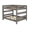 Gray wood twin-over-full bunk bed frame with safety guardrails, slatted mattress supports and rustic gray finish