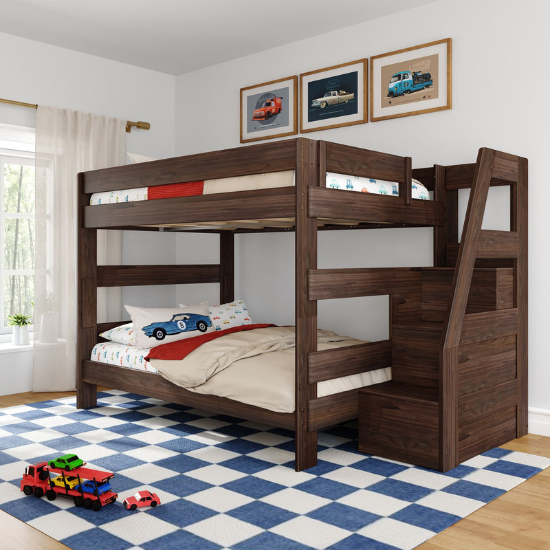 Dark walnut two-level wooden bunk bed with built-in staircase storage in a bright children's bedroom with car-themed bedding, blue checkered rug and toy cars
