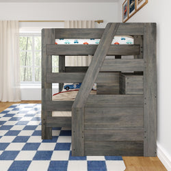 Gray rustic twin bunk bed with staircase storage in kids bedroom, car-themed bedding, blue checkered rug and window with curtains