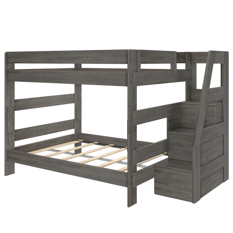 Gray wood twin-over-full bunk bed with built-in storage staircase, slatted mattress platform, safety guardrails and modern farmhouse finish