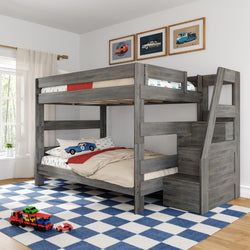 Gray wooden twin-over-full bunk bed with built-in stair storage in a kids' bedroom, car-themed bedding, blue-and-white checkered rug and toy cars