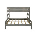 Gray wooden bunk bed with lower platform and upper bunk, slatted mattress support, modern space-saving kids' bedroom furniture