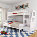 Children's bedroom with white wooden loft bunk bed, car-themed bedding and pillows, built-in storage stairs, framed car prints, blue checkered rug and toy cars