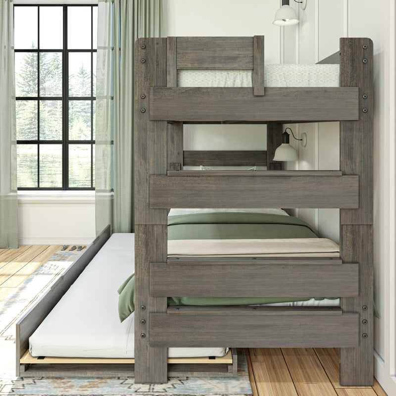 Rustic gray wooden twin-over-twin bunk bed with pull-out trundle, green bedding and curtains, large grid window and wall sconce in a bright modern farmhouse kids' bedroom
