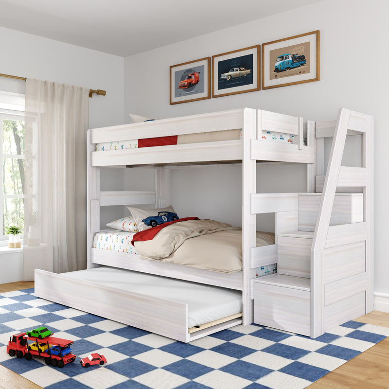 White wooden twin-over-twin bunk bed with staircase storage and pull-out trundle in a bright kids' bedroom, featuring car-themed bedding, blue check rug and framed car prints