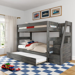 Kids gray wooden bunk bed with pull-out trundle and built-in staircase storage, car-themed bedding and toy cars on blue checkered rug