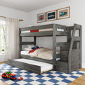 Gray wooden bunk bed with pull-out trundle in kids' bedroom, car-themed bedding and framed posters, toy cars on blue checkered rug