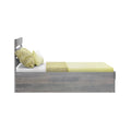 Side view of modern grey wood twin bed with yellow pillows, textured yellow throw and minimalist bedding