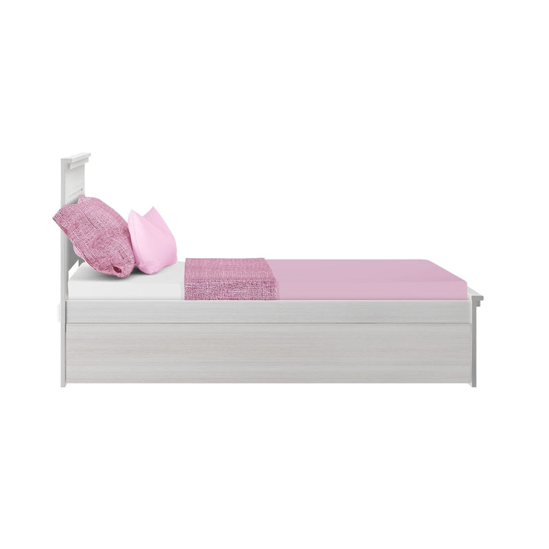 White wooden twin platform bed with pink fitted sheet, two pink pillows and textured pink throw, side view — modern storage bedroom furniture for kids and teens