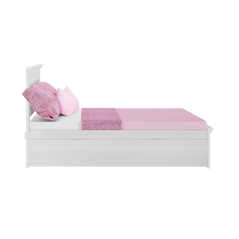 White wooden twin bed with pink bedding and matching pillows.