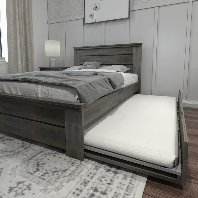 Wooden bed frame with a pull-out trundle bed in a modern bedroom setting.