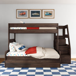 Dark wood twin-over-full bunk bed with built-in staircase storage, car-themed children's bedding, blue checkered rug and framed vintage car prints in a modern kids bedroom