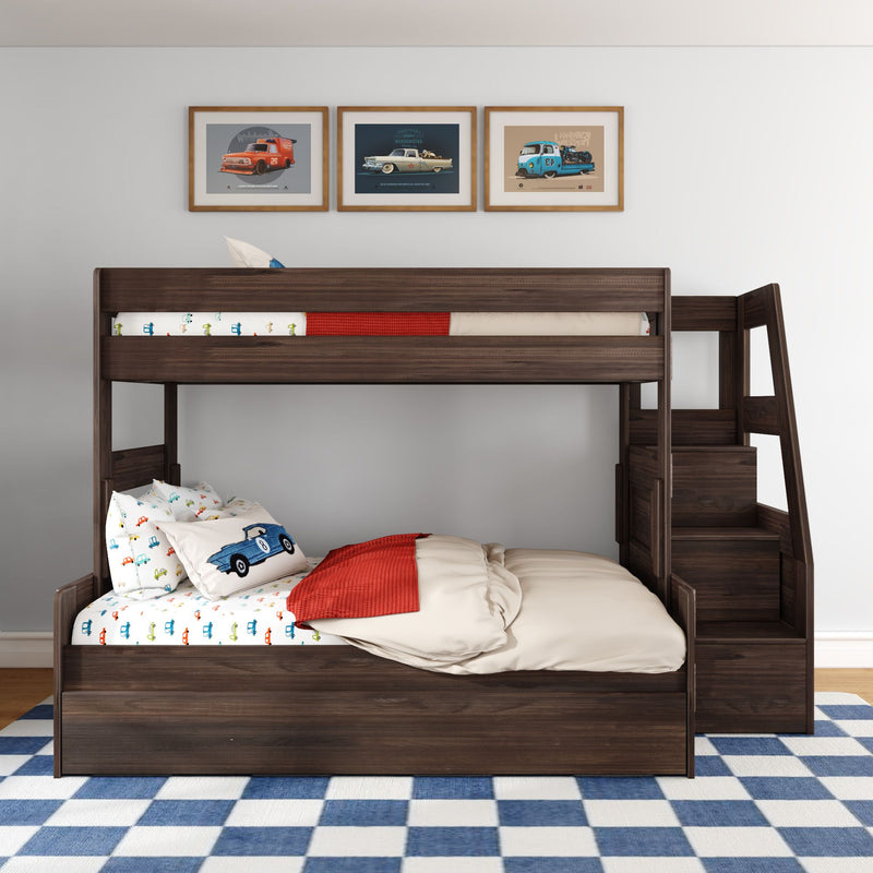 Dark wood twin-over-full bunk bed with built-in staircase storage, car-themed children's bedding, blue checkered rug and framed vintage car prints in a modern kids bedroom