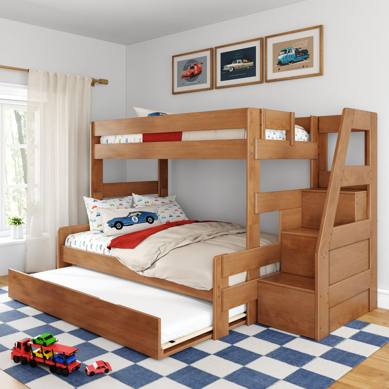 Wooden bunk bed with pull-out trundle and stair storage in a children's bedroom with car-themed bedding, framed car prints, and blue check rug