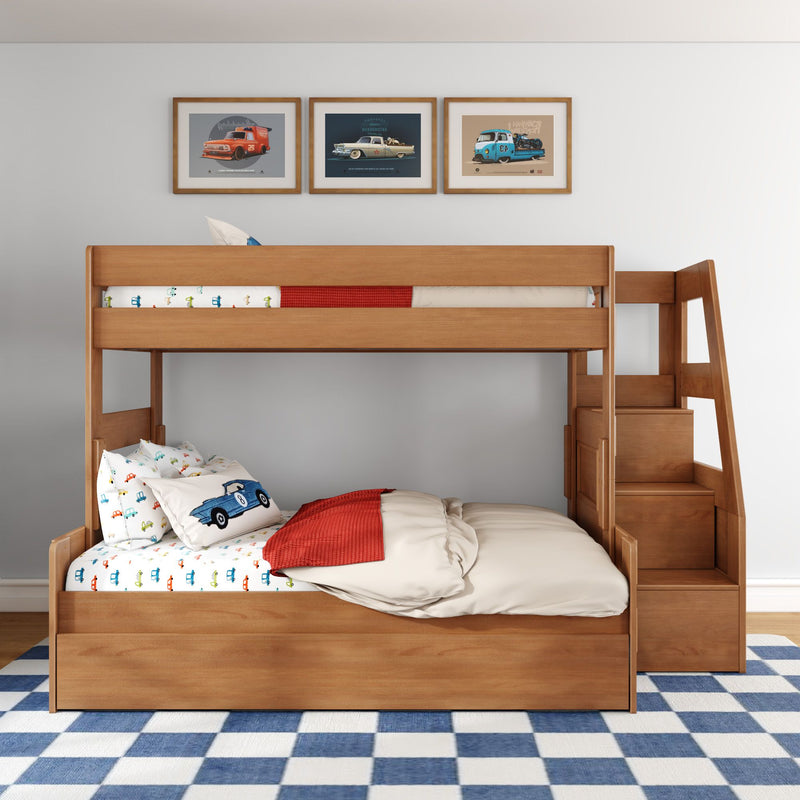 Wooden bunk bed with built-in staircase storage in kids' bedroom, car-themed bedding and framed vintage car prints over blue-and-white checkered rug