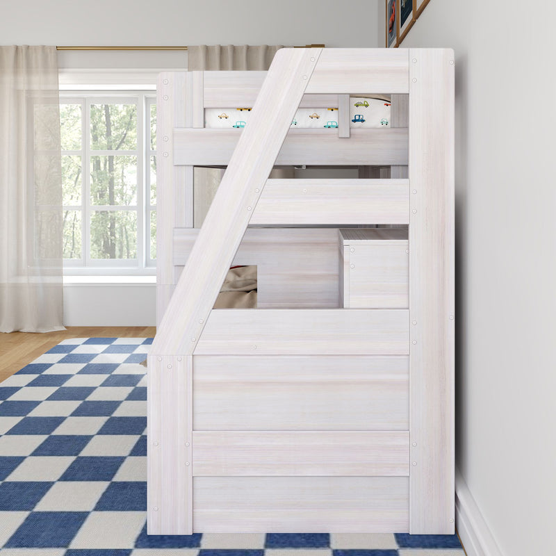 Whitewashed wooden loft bunk bed with slanted ladder and car-print bedding in bright kids' bedroom with blue checkered rug and window