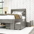 Modern gray wooden platform bed with built-in under-bed storage drawers, slatted headboard, white linen bedding and bedside lamp in modern farmhouse bedroom