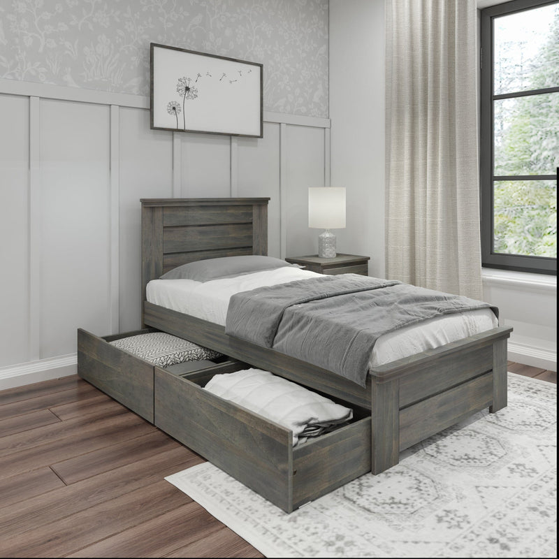 Gray wooden twin bed with under-bed storage drawers, neutral bedding and lamp in modern farmhouse bedroom with linen curtains