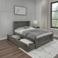 Rustic gray wooden platform storage bed with built-in pull-out drawers in a modern farmhouse bedroom, gray bedding, matching nightstand and lamp, wood floors, patterned rug and framed dandelion wall art by a large window