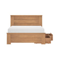 Light oak wooden platform bed with paneled headboard, white mattress, and built-in under-bed storage drawers on casters — modern farmhouse storage bed