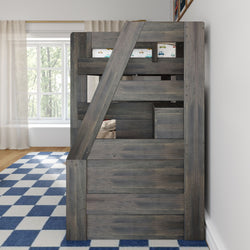 Gray rustic wooden twin-over-twin loft bunk bed with built-in storage and ladder in a child's bedroom, blue checkered rug, car-print bedding, and large window with sheer curtains