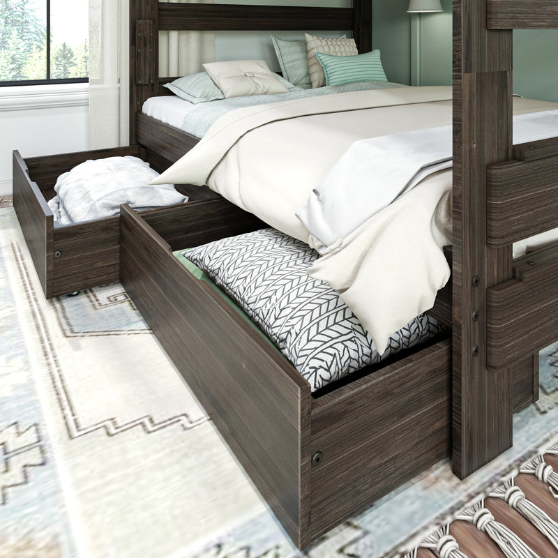 Dark wood bunk bed with open under-bed storage drawers holding pillows and linens, neutral beige and mint bedding, and a light rug in a modern farmhouse bedroom