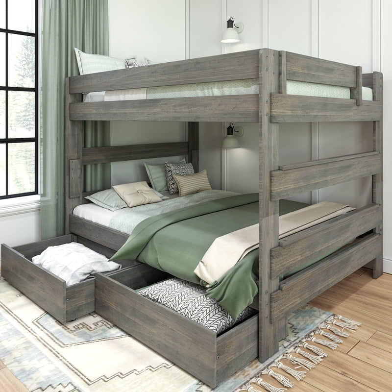 Rustic gray wooden bunk bed with pull-out under-bed storage drawers, green bedding and pillows in a bright modern kids' bedroom