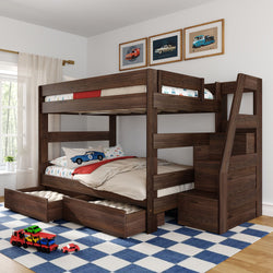 Dark walnut wooden twin-over-full bunk bed with staircase storage and under-bed pull-out drawers in children's room with car-themed bedding and blue checkered rug