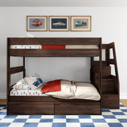 Dark walnut two-level wooden bunk bed with staircase and under-bed storage drawers, styled with car-themed bedding, red throw, blue checkered rug, and framed vintage car wall art in a child's bedroom.