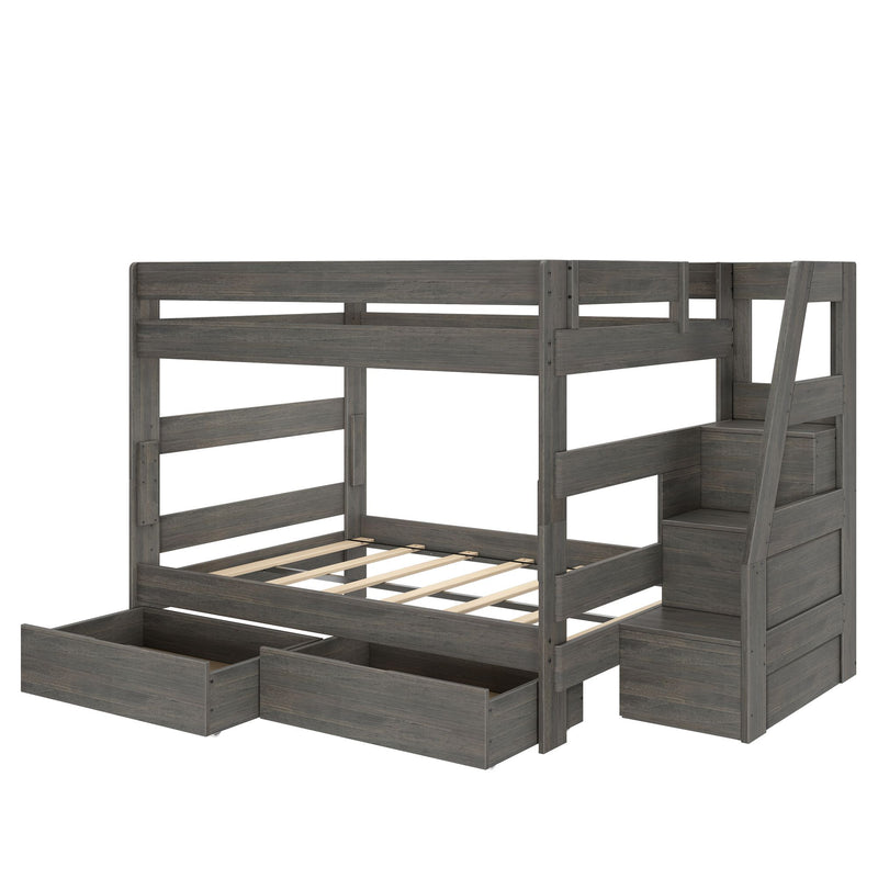 Gray wooden bunk bed with built-in storage staircase, pull-out under-bed drawers, and slatted mattress support