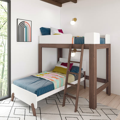 Modern space-saving wooden loft bunk bed for kids with ladder and white guardrails, blue mattress and colorful geometric bedding, wall sconce and abstract rainbow art in bright children's bedroom
