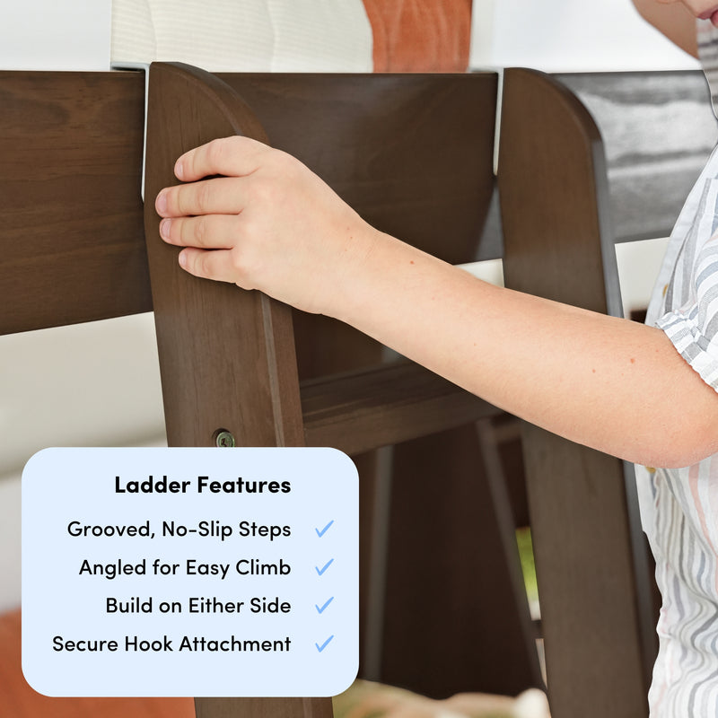 Close-up of a hand adjusting a wooden bunk bed ladder rung, highlighting grooved no-slip steps, angled design for easy climbing, and secure hook attachment