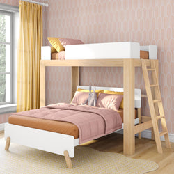 Natural wood twin-over-full bunk bed in kids' room with pink wallpaper, blush bedding, yellow curtains and stuffed rabbit.