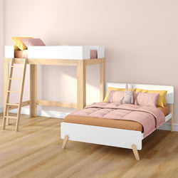 Scandinavian kids bedroom with wooden loft bunk bed and white single bed, pink bedding, yellow pillows, plush rabbit on light hardwood floor