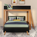 Modern wooden bunk bed with black safety panels, mint and navy bedding, striped pillows, yellow bolster and ladder in a cozy kids' bedroom