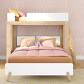 Children's modern wooden loft bunk bed with pink bedding and yellow pillows, pastel arched wallpaper and plush bunny toy — kids bedroom decor